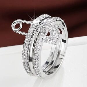 Elegant Silver Ring with Safety Pin Design
